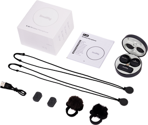 Set of wireless microphone components including a box, cables, and accessories on a white background