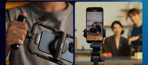 Person holding a smartphone with a camera rig and a phone screen showing a video call.